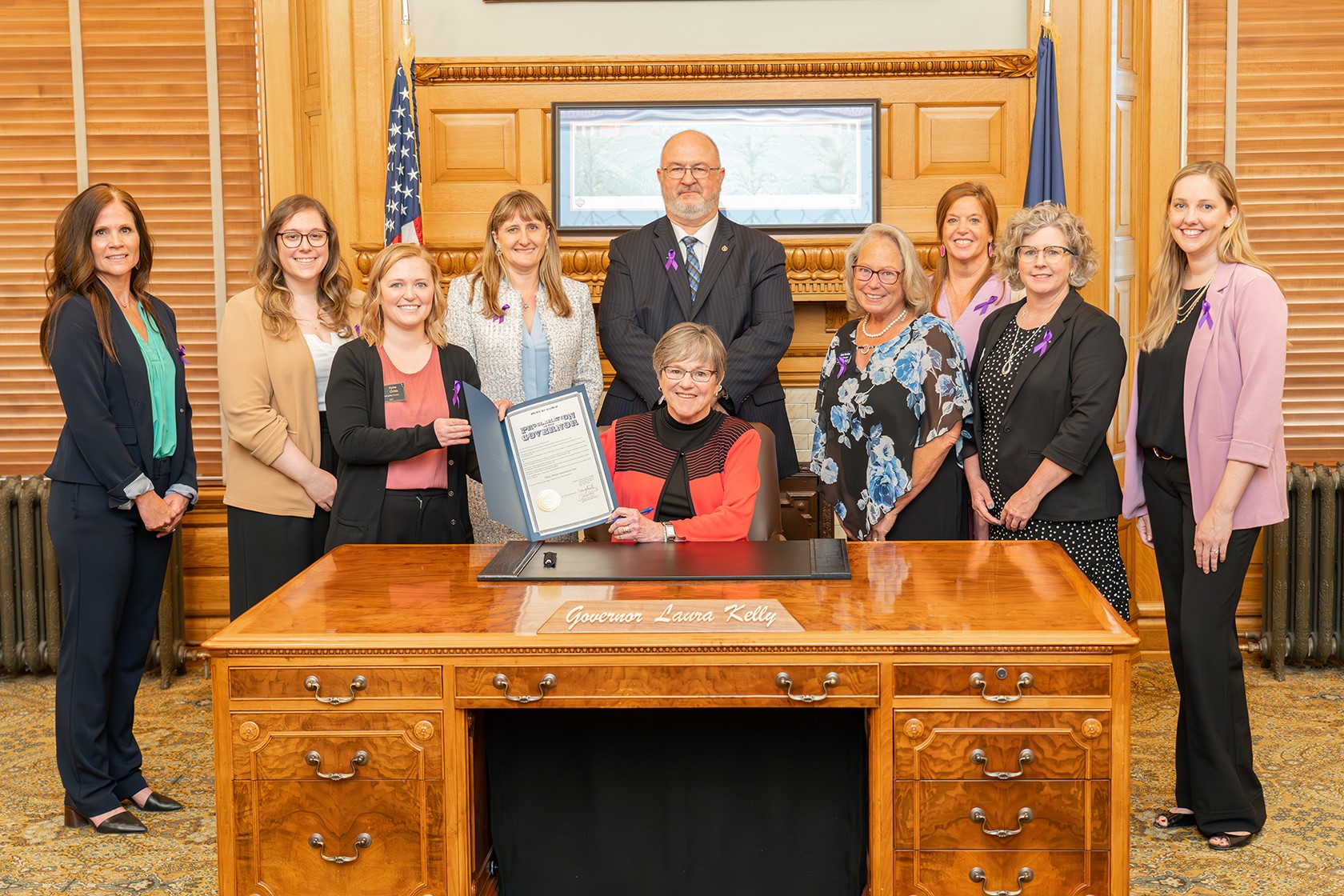 Gov. Laura Kelly signing the Elder Abuse Awareness Day Proclamation